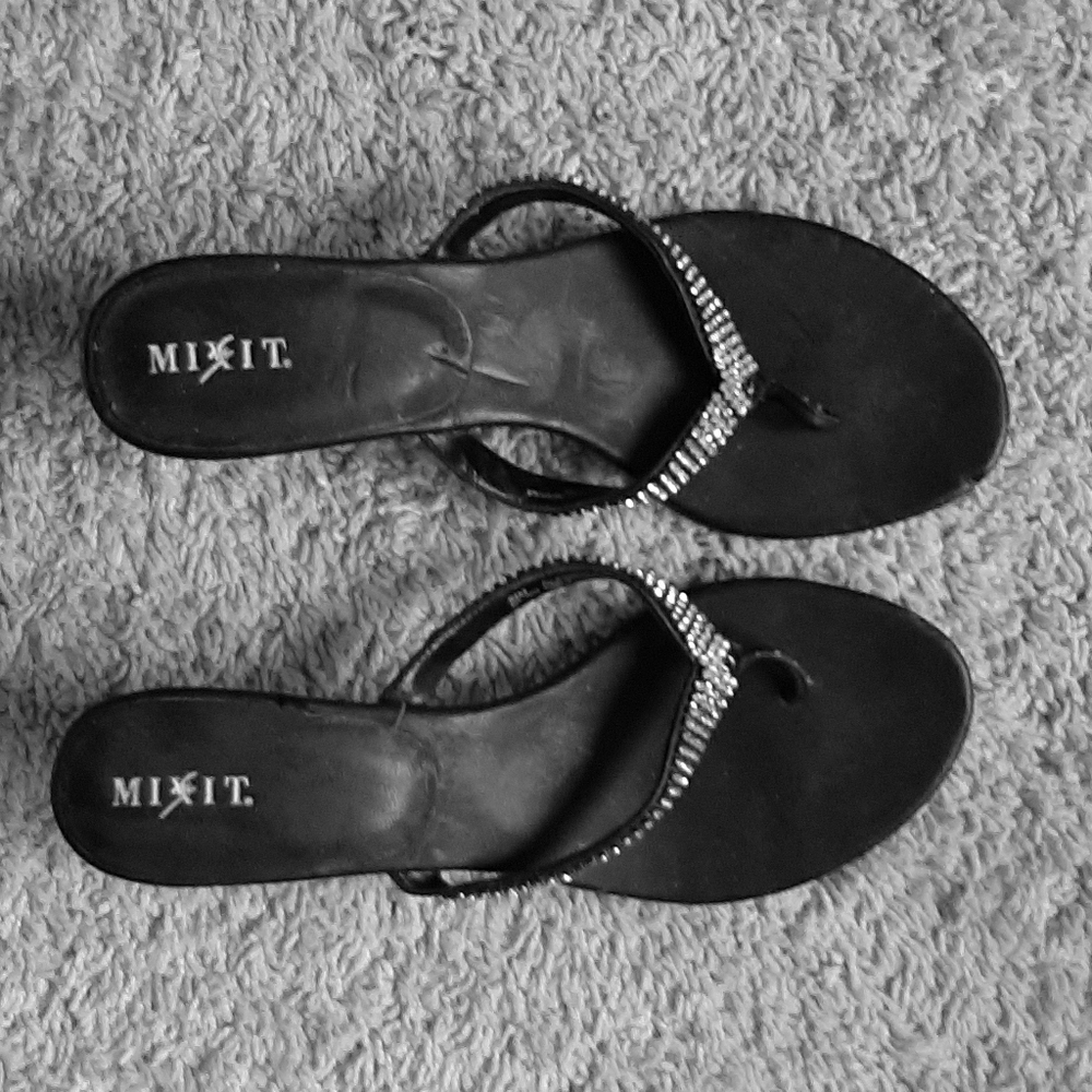Black heeled formal sandals.